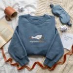 Lollidollyart Funny Exhausted Duck Embroidered Sweatshirt - Navy Personalized Gift MTG 260320 020 AI Mockup 20260321 131904.webp