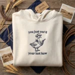Lollidollyart Cowboy Goose Meme Embroidered Hoodie - Sand Personalized Gift MTG 260320 016 AI Mockup 20260321 165522.webp