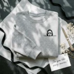 Pocket Ghostface Embroidered Sweatshirt - Subtle Peeking Horror Mask Design embroidered-sweatshirt
