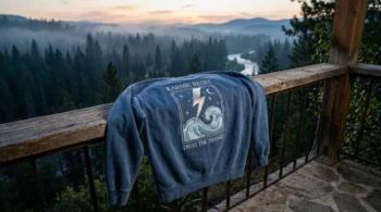 Prepare for april 7 2026 astrology with this cozy Washed Indigo Karmic Reset embroidered sweatshirt draped on a balcony.