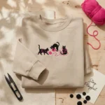 Black Cat Gift Embroidered Sweatshirt - Playful Trio with Pink Yarn Design embroidered-sweatshirt